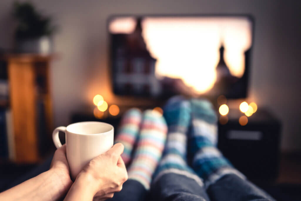 couple with socks and tv in background