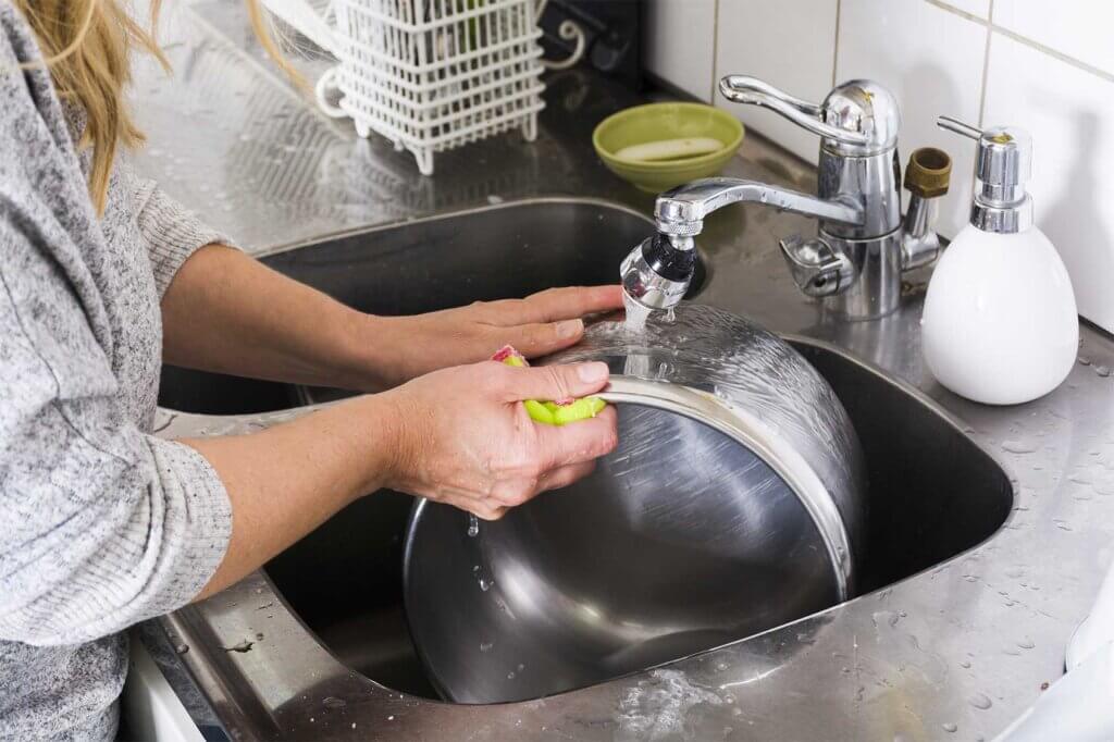 woman washing in the cowl