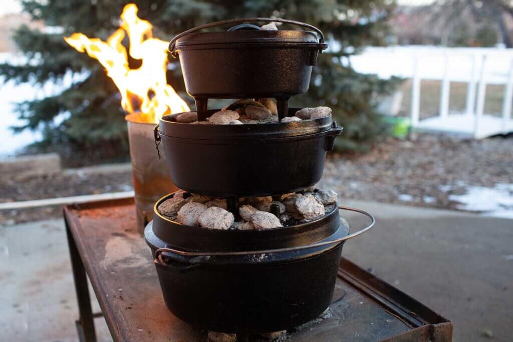 Three Dutch ovens stacked on top of each other