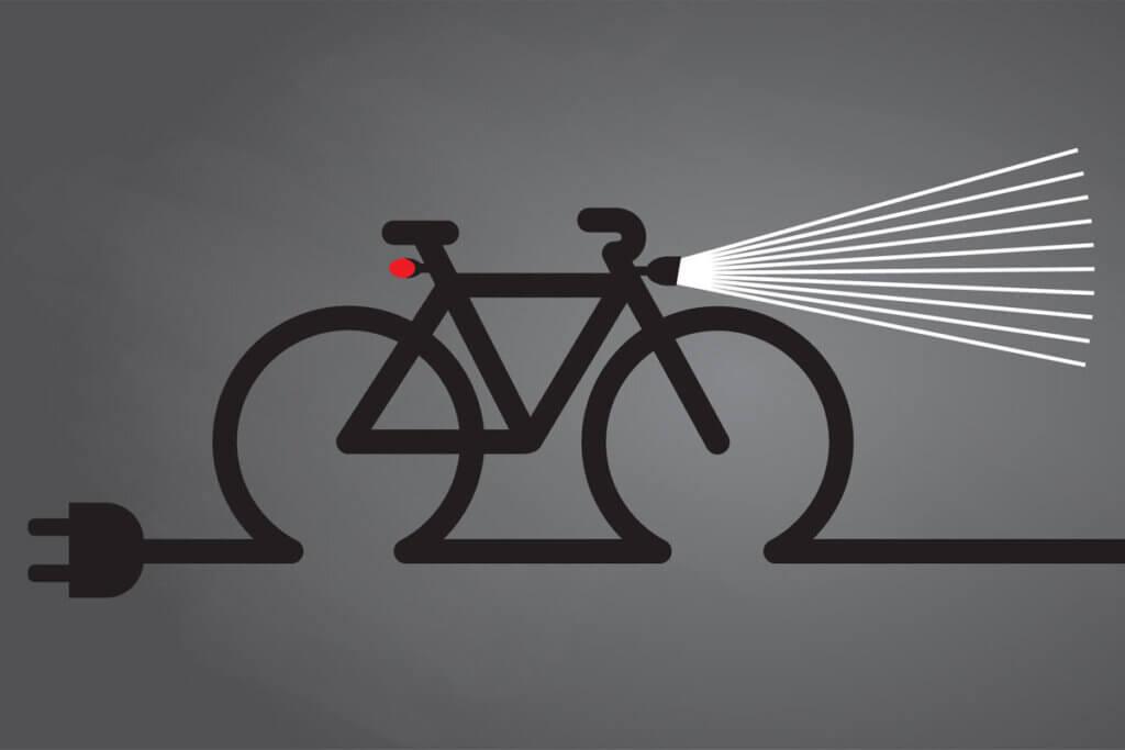 Symbol of a bicycle with front and rear lights