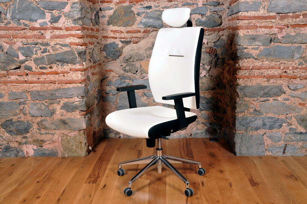 white office chair stands in a room