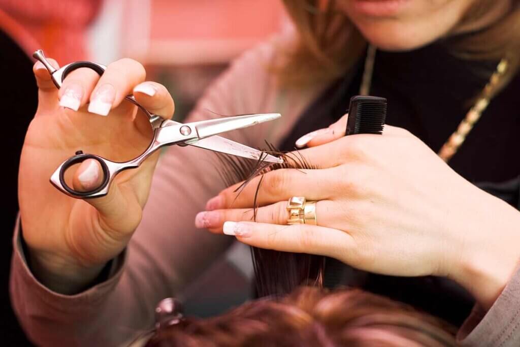 hair stylist cutting hair