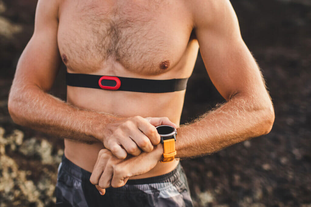  Man with Heart rate monitor watch and chest strap