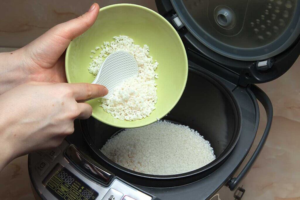 person fills up with rice