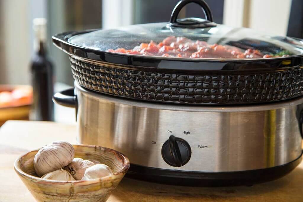  finished food in the slow-cooker is on the table