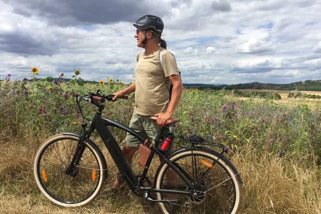  man rides e bike across fields